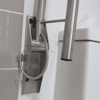 Drop down toilet grab rail